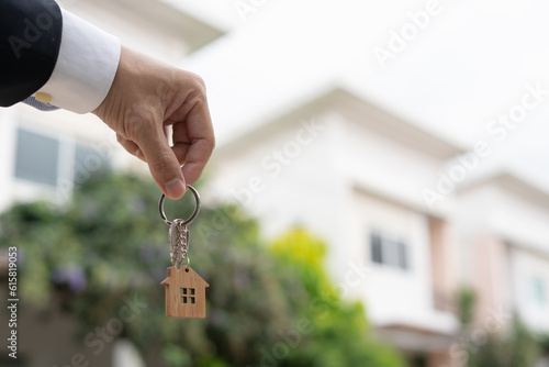 lease, rental and selling home. Real estate agent manager smile holding key for new owner. rent house, Sales, loan credit financial, insurance, Seller, dealer, installment, buy, sell, move in