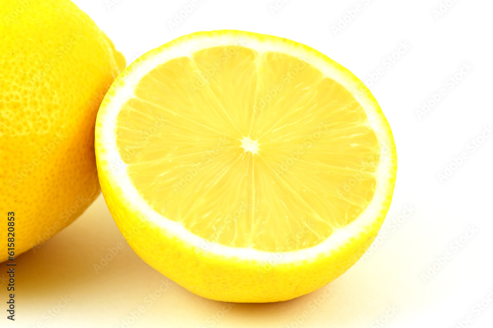 Ripe haft yellow citrus lemon fruitcisolated on white background.High vitamin C fruit. Ripe haft yellow citrus lemon fruitcisolated on white background.High vitamin C fruit.