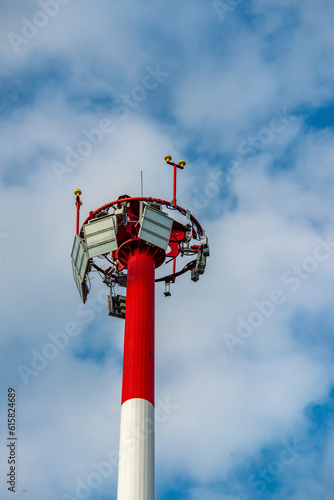 Sightseeing tower on a background of blue sky with clouds.