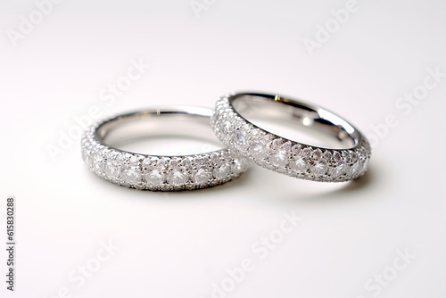 Designer wedding rings on a sparkling white background