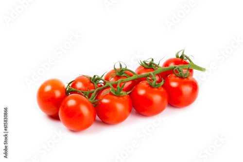 Sprig of cherry tomatoes isolated on white background. Red fresh tomatoes. Fresh vegetables. Vegan. Close-up. Healthy food. Salad Ingredients.