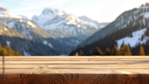 Wooden table with a scenic top with blur background of Alpine with snow capped.   © BlazingDesigns