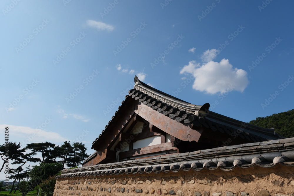 A traditional Korean house and fence A traditional Korean house and fence