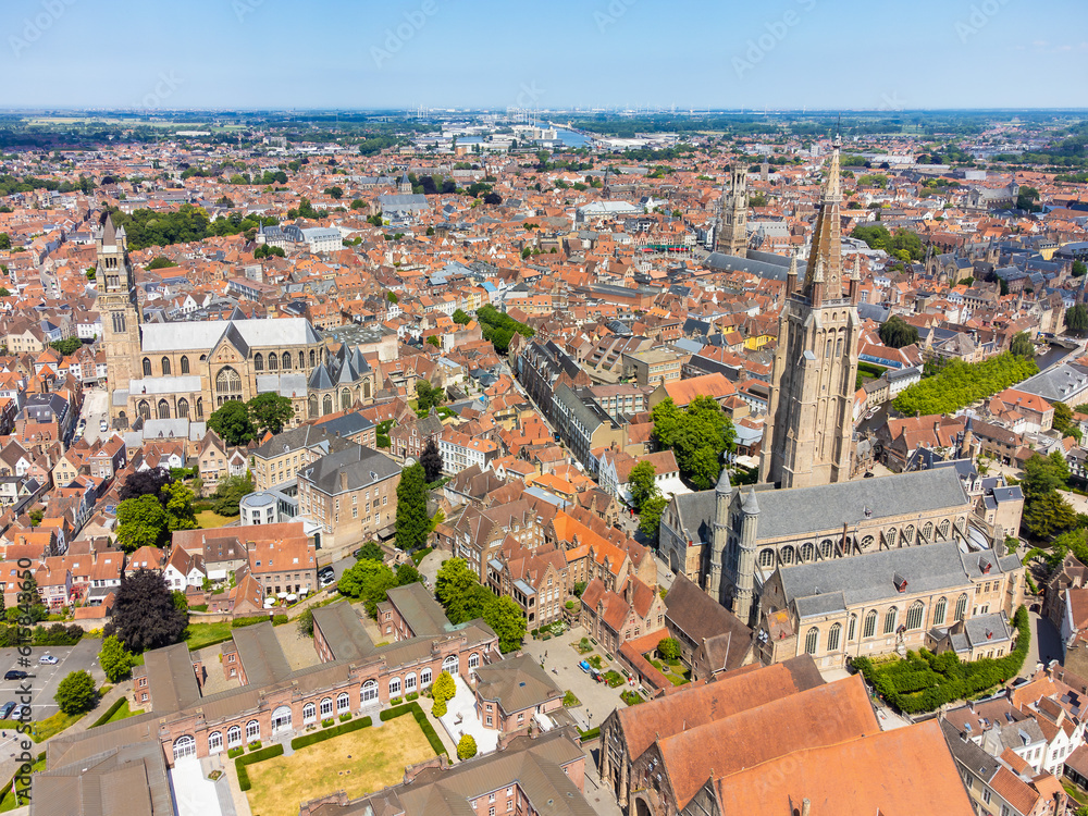 Aerial drone cityscape with the Notre Dame (Our Lady) church of Bruges and the St. Salvator's Cathedral (Saint Savior), the Roman Catholic cathedral and main church of Bruges, Belgium.