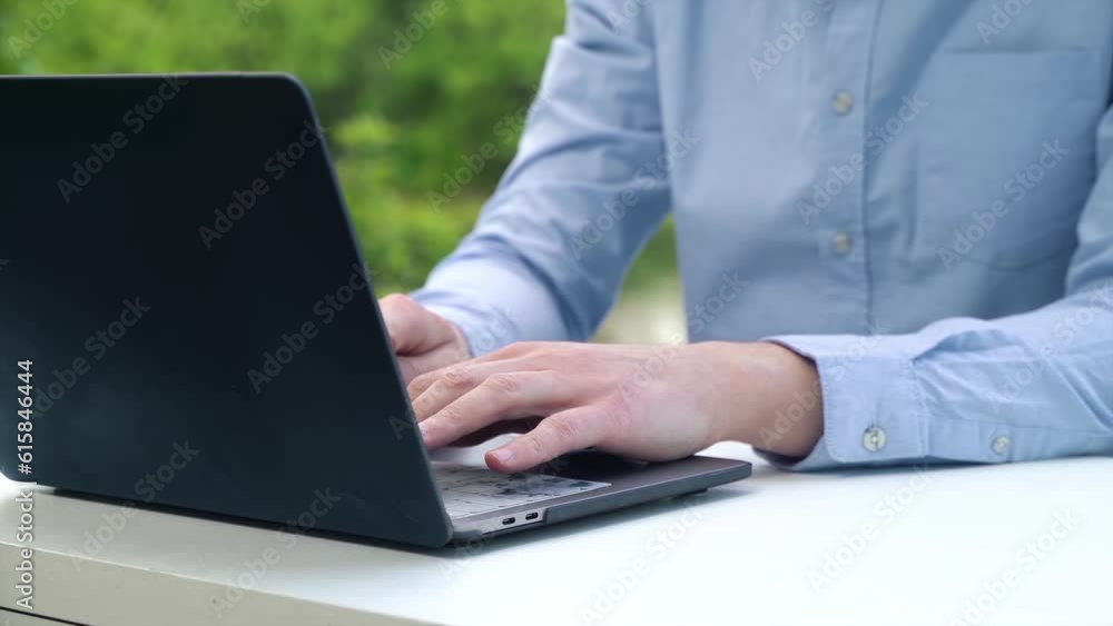 Close-up of hands typing on laptop keyboard Close-up of hands typing on laptop keyboard