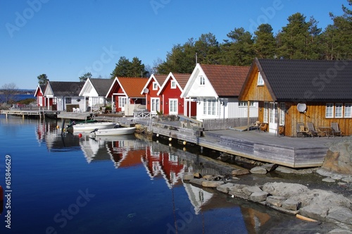 Traditional Norwegian Wooden Houses overlooking the water. 