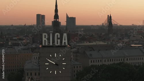 Panoramic aerial view of the Riga cathedral and the old town of Riga, Latvia. Magical sunset over the Latvian capital. Beautiful Riga clock tower.