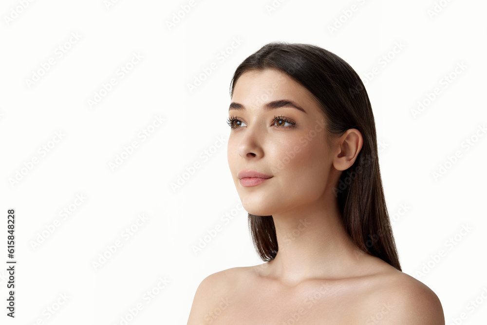 Portrait of attractive, young, brunette woman with bare shoulders, perfect well-kept face, looking straight over white studio background. Concept of female beauty, body and skincare, cosmetology, ad Portrait of attractive, young, brunette woman with bare shoulders, perfect well-kept face, looking straight over white studio background. Concept of female beauty, body and skincare, cosmetology, ad
