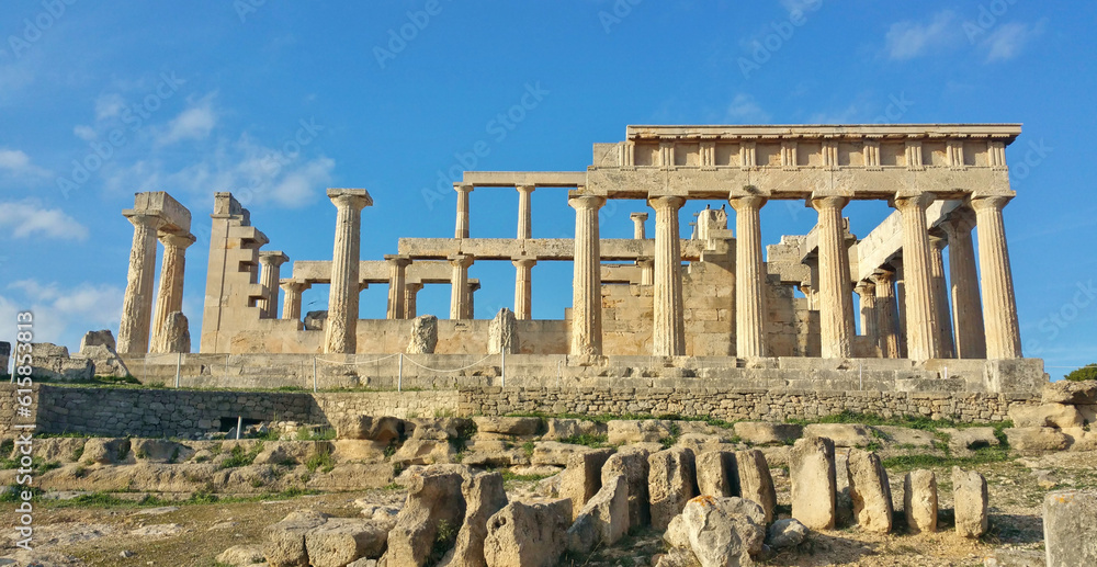 Greek ruins at the Temple of Aphaia on the island of Egina (Saronic Islands Aegean Sea) ancient roman columns, blue sky golden hour soft light (goddess monument) historic remains, Greece Mediterranean