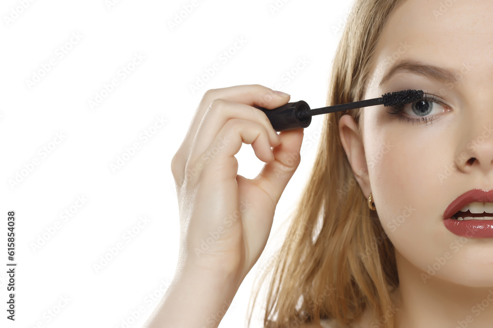 woman applying mascara