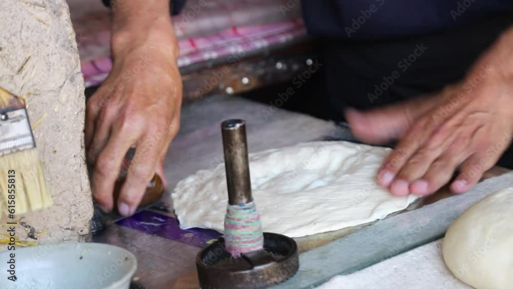 The baker applies patterns to the dough The baker applies patterns to the dough