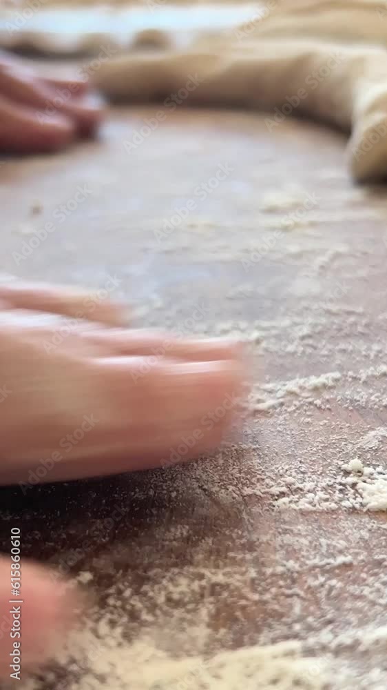 kind old hands of an elderly woman grandmother roll out the dough she will cook pies and bake something or boil dumplings or dumplings on a wooden surface soft fresh dough. High quality 4k footage kind old hands of an elderly woman grandmother roll out the dough she will cook pies and bake something or boil dumplings or dumplings on a wooden surface soft fresh dough. High quality 4k footage