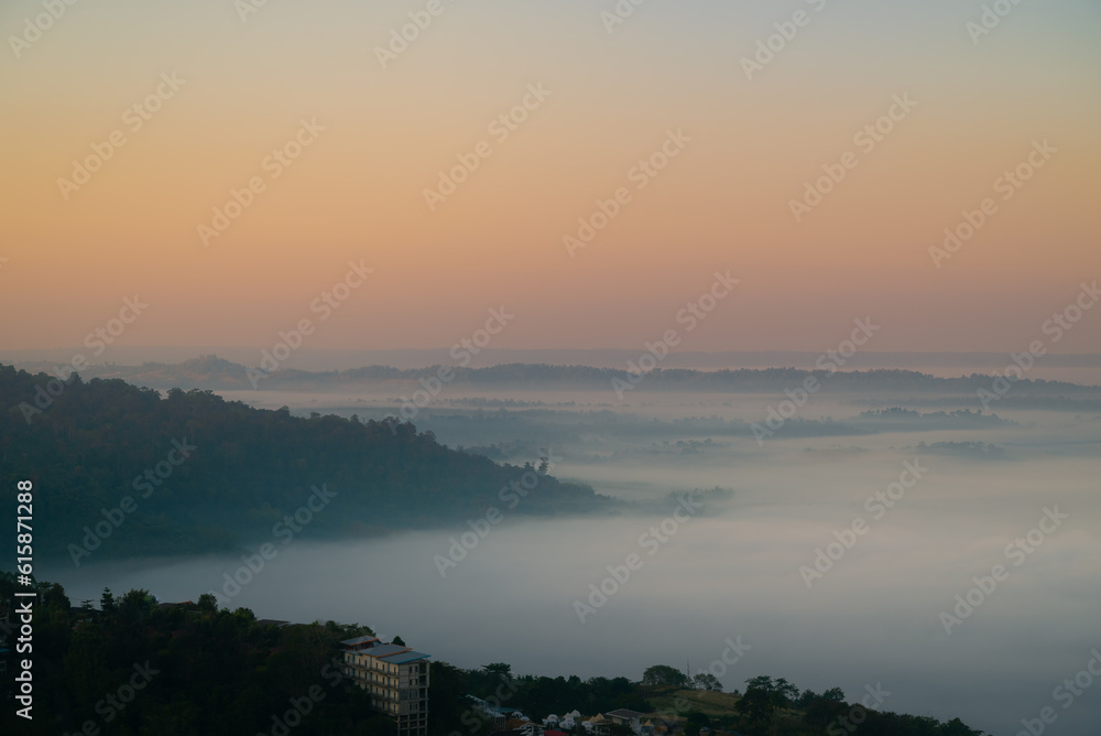 sunrise over the mountains with thick fog