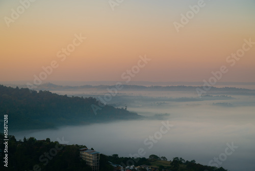sunrise over the mountains with thick fog