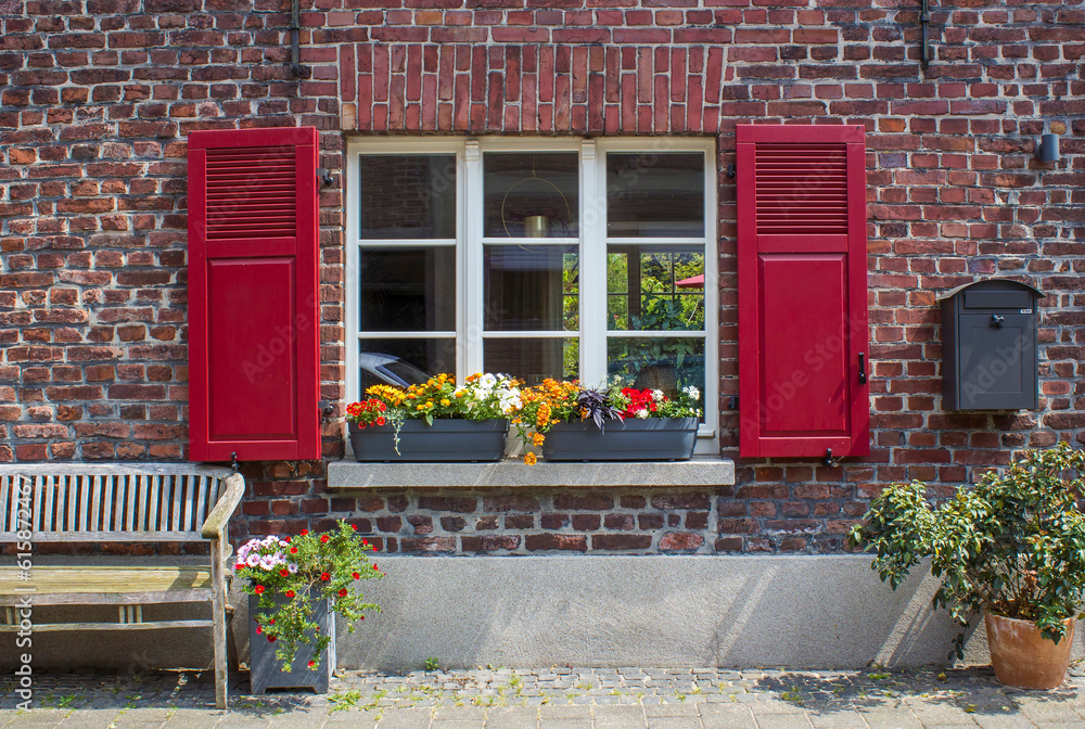 Old German house with window with wooden shutters, Wachtendonk