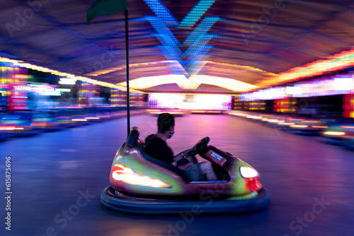 A bumper car in the middle of the stage in a fair