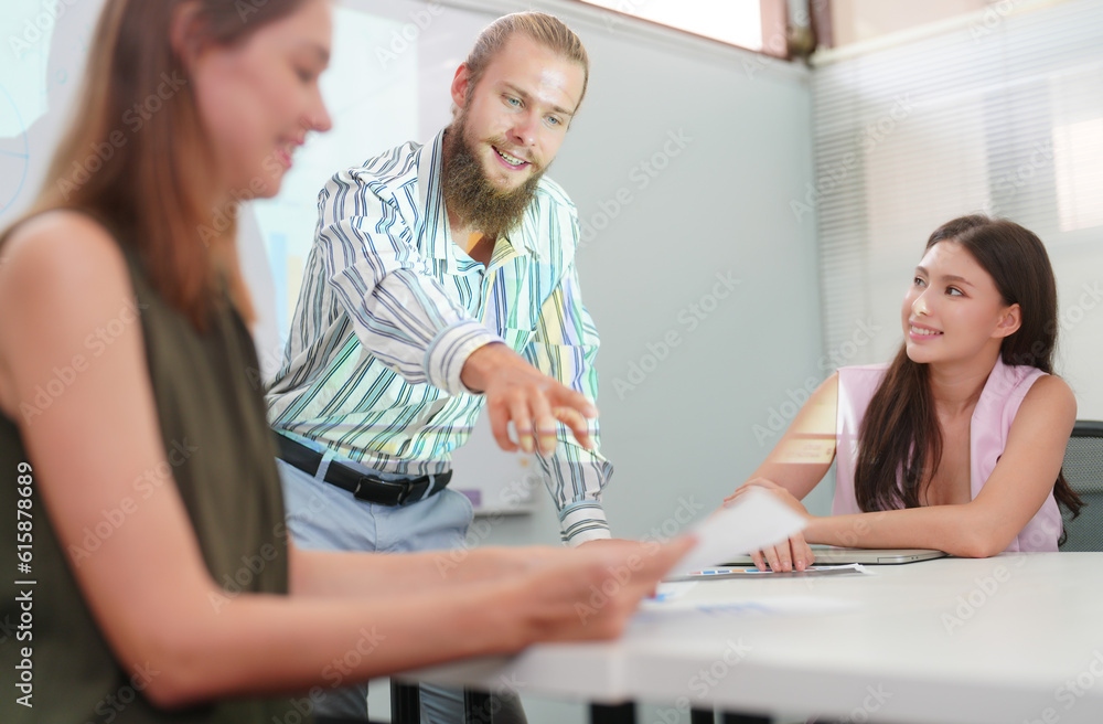 Young office worker presenting new financial plan to his partners during a meeting Young office worker presenting new financial plan to his partners during a meeting
