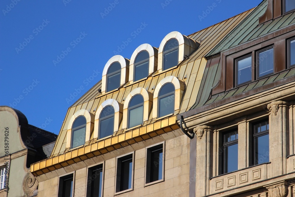 Facade of a building with Gold roof.