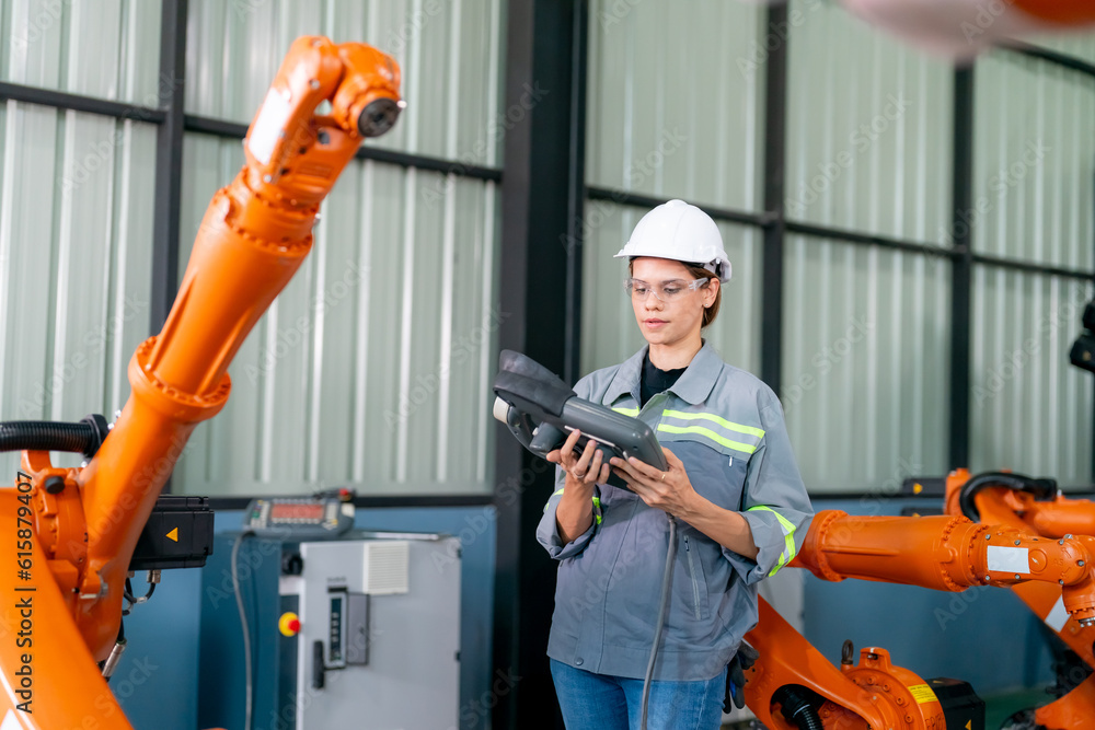 Technology Engineer Working in Factory. Holding check-list and supervising Technology Engineer Working in Factory. Holding check-list and supervising