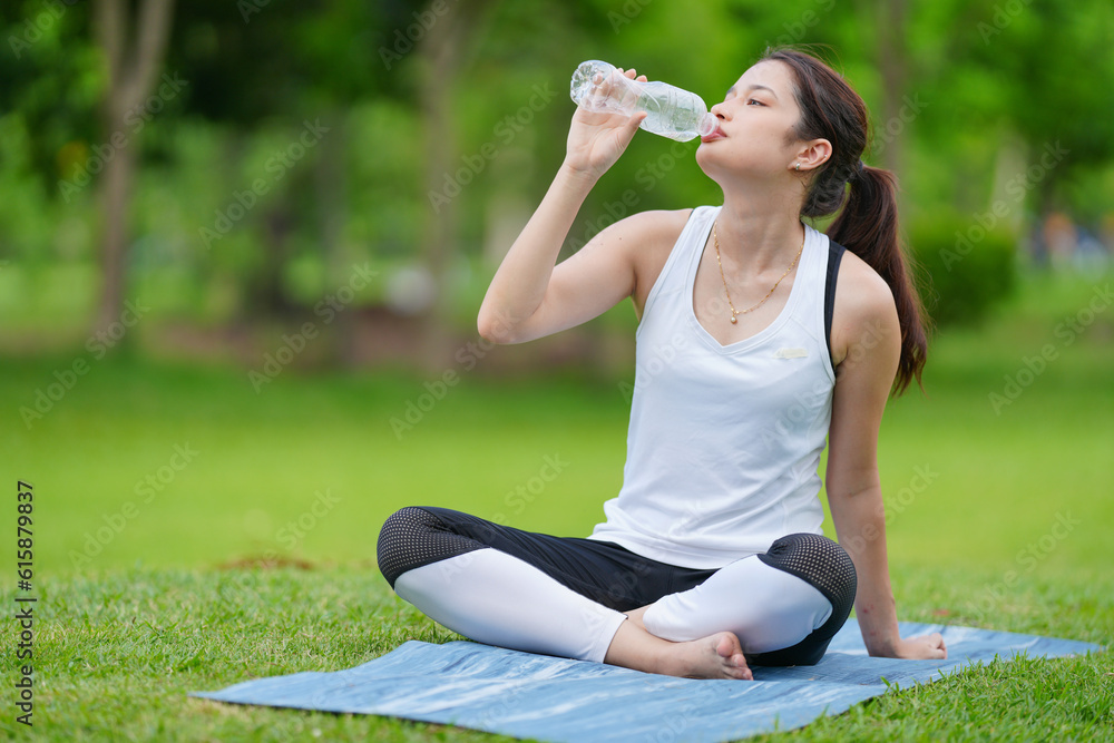 Pleasant millennial woman practice yoga outdoor in the morning during wellness retreat. Pleasant millennial woman practice yoga outdoor in the morning during wellness retreat.