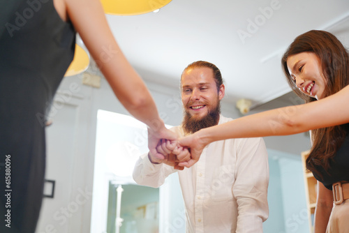 Young office worker presenting new financial plan to his partners during a meeting