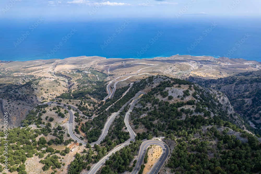 Aerial summer sunny view of serpentine mountain road near Imbros Gorge, Crete, Greece