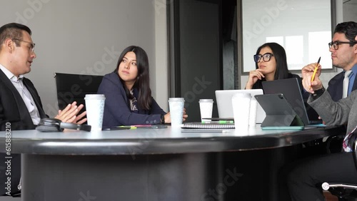 young business people having a meeting at the office, female leader listening to male employees suggestions, work team brainstorming