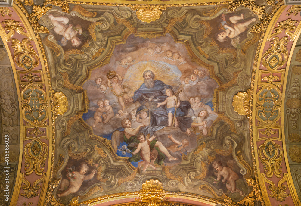 GENOVA, ITALY - MARCH 5, 2023: The fresco of Holy Trinity among the angels in the church Chiesa di Santa Maria Maddalena by Giacomo Antonio Boni (1688 – 1766).