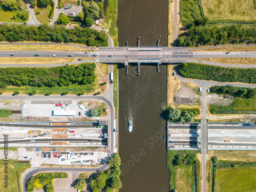 Topdown view of a navigable aquaduct under construction and yacht photo