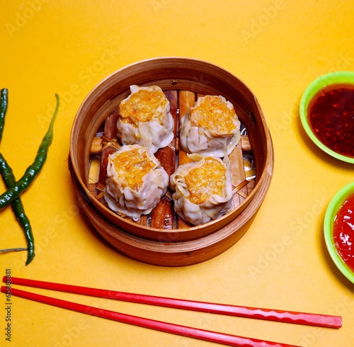 hot and delicious dimsum photo with a sweet and sour tomato sauce, a perfect blend to accompany your day

