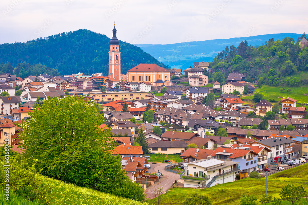 Idyllic Alpine town of Kastelruth on green hill view, Trentino Alto Adige region of Italy