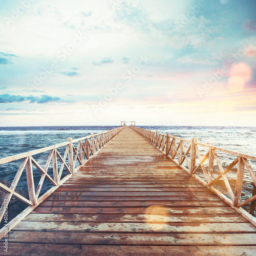 Pier on the sea at sunset. Freedom and relax concept