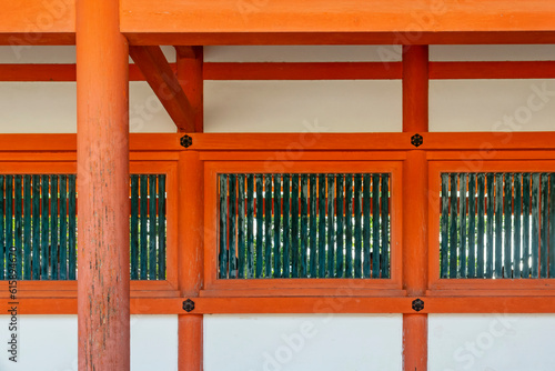 Abstract east-Asian vintage background featuring details of Japanese traditional wooden roofs, walls and windows with parallel and perpendicular elements in Kyoto, Japan.