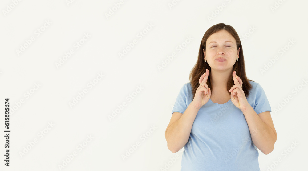 Portrait of excited hopeful pregnant woman making wish crossed fingers for good luck, close eyes and smiling putting all effort into pray, pleading for dream come true Portrait of excited hopeful pregnant woman making wish crossed fingers for good luck, close eyes and smiling putting all effort into pray, pleading for dream come true