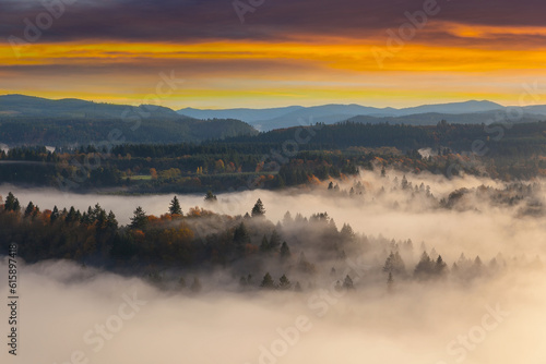 Rolling fog along Sandy River Valley in Clackamas County Oregon during sunrise