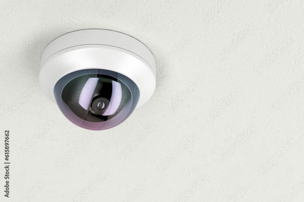 Surveillance camera attached on white ceiling Surveillance camera attached on white ceiling