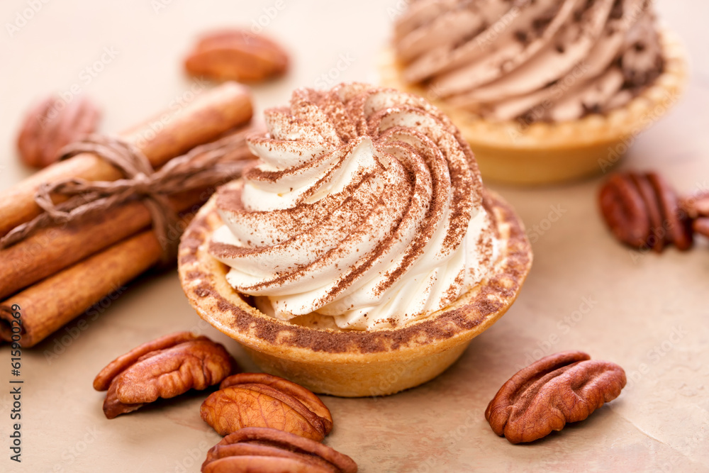 Delicious mini tarts with whipped cream and pecans.