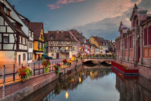 Cityscape image of downtown Colmar, France during sunset.