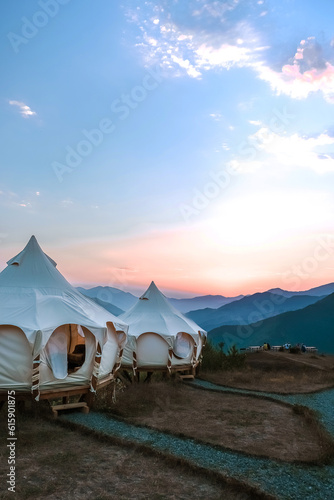 Travel. Girl travels through mountains glamping  tents nature.Unity mental health eco travel.Hiking mountains wildlife van life vibes wellness travel  retreat digital detox natural landscapes