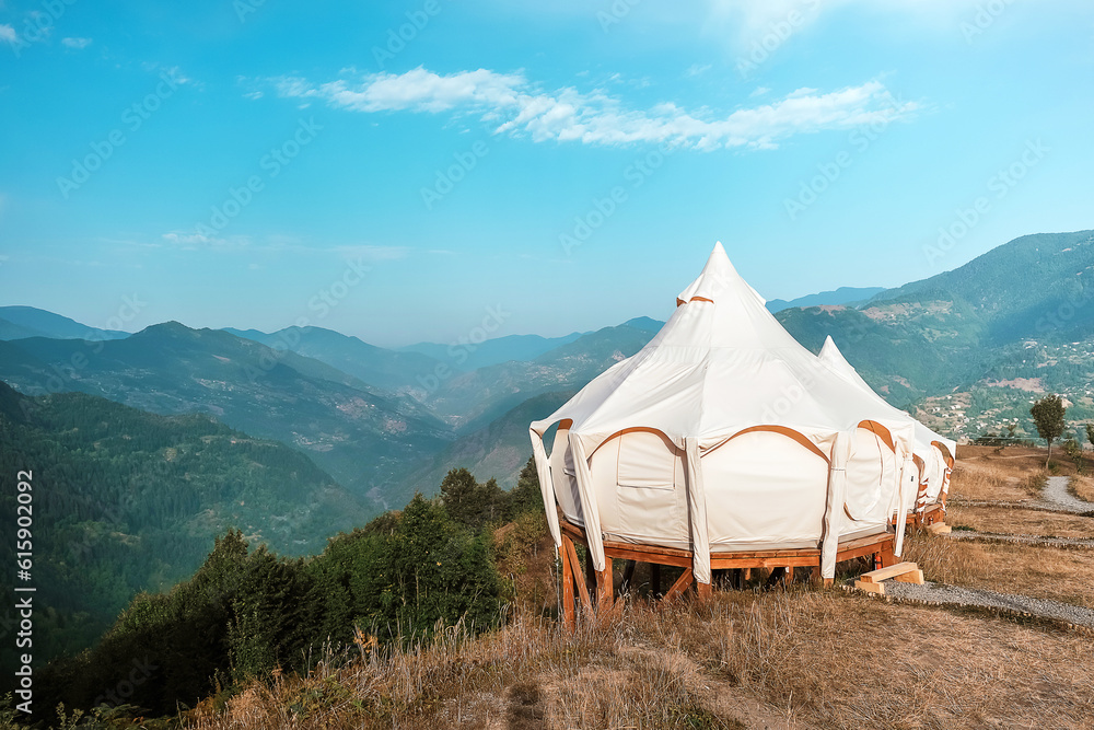 Travel. Girl travels through mountains glamping, tents,nature.Unity