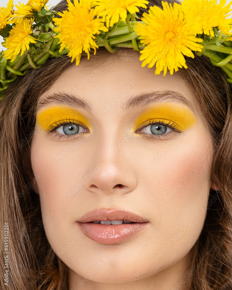 Young woman in national clothes wearing yellow dandelion wreath Young woman in national clothes wearing yellow dandelion wreath