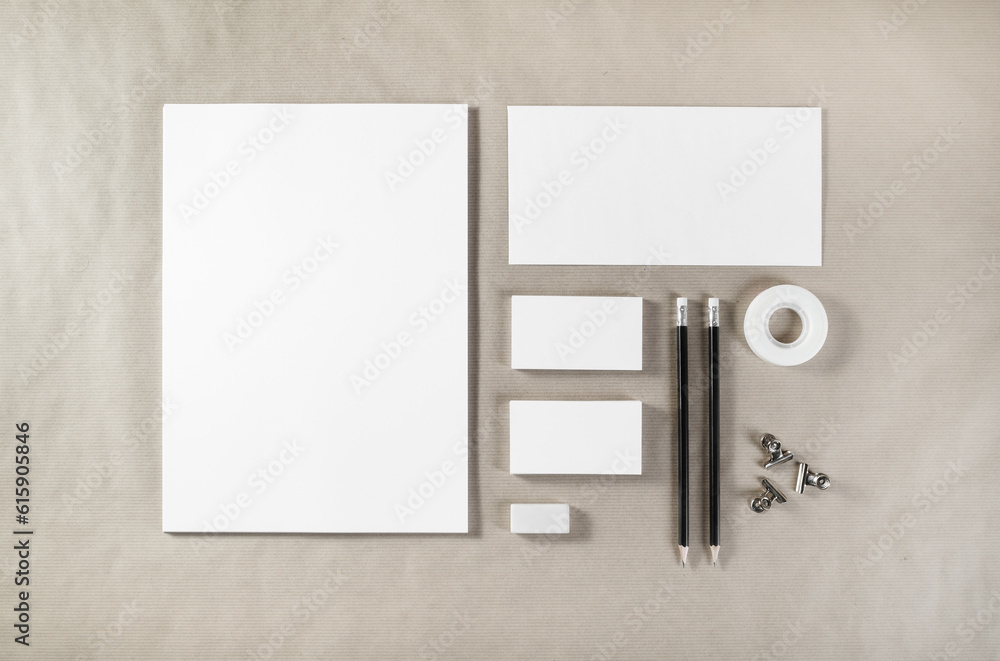Photo of blank stationery. Corporate identity template on paper background. Mock up for design portfolios. Top view. Photo of blank stationery. Corporate identity template on paper background. Mock up for design portfolios. Top view.