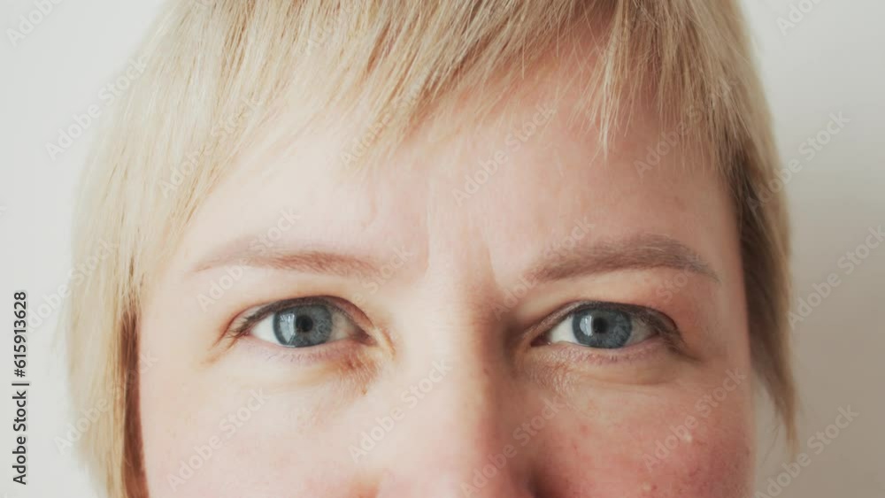 Close up portrait of a beautiful Caucasian woman with gray eyes. Ophthalmology Close up portrait of a beautiful Caucasian woman with gray eyes. Ophthalmology