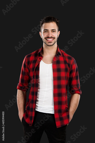 Portrait of a handsome young man, isolated over a gray background