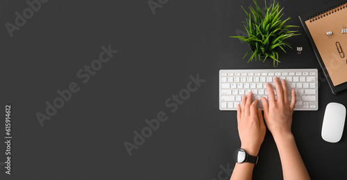 Hands of woman using comput...