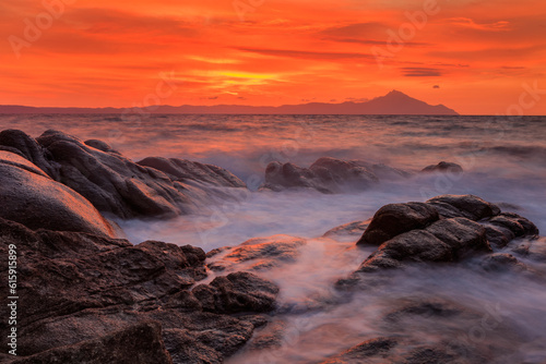 Vourvourou - Karidi beach with mount Athos in the background surprised at sunrise. photo