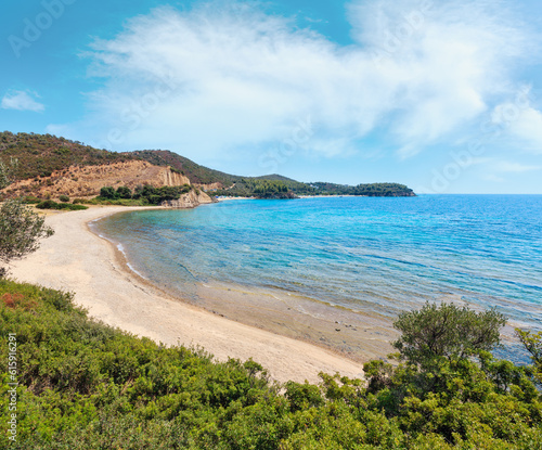 Summer Aegean Sea coast landscape with sandy beach and wild camping (Sithonia, Halkidiki, Greece).