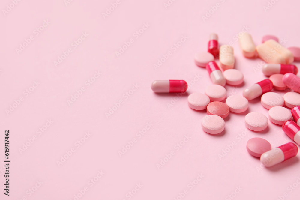 Different pills on pink background, closeup Different pills on pink background, closeup