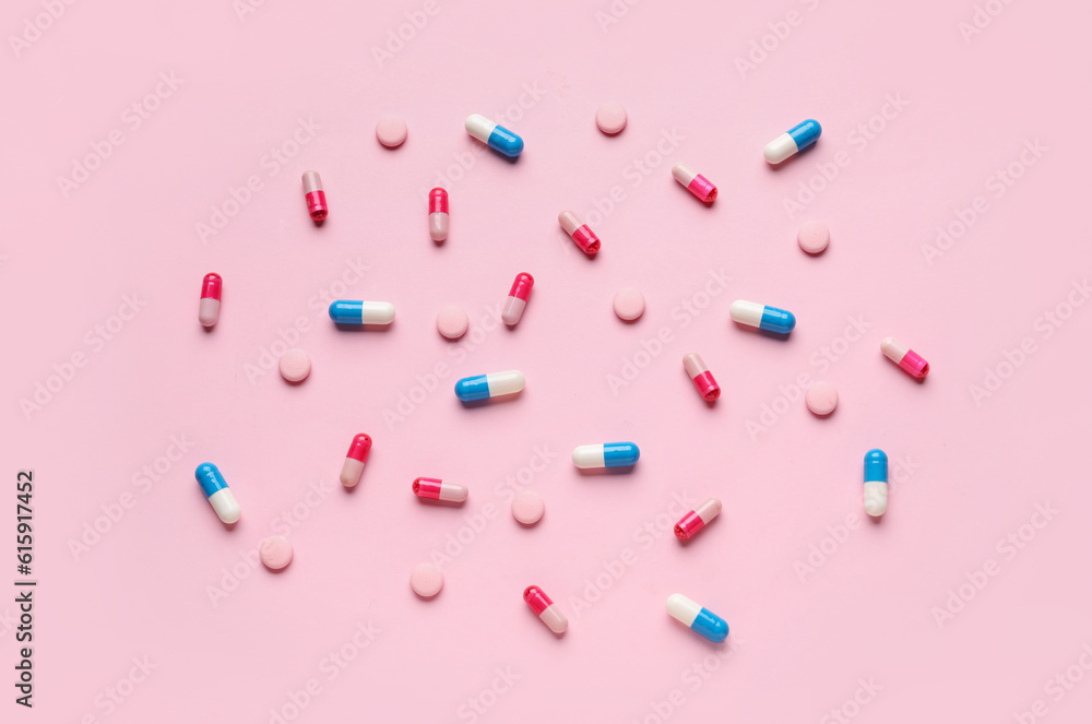 Different pills on pink background Different pills on pink background