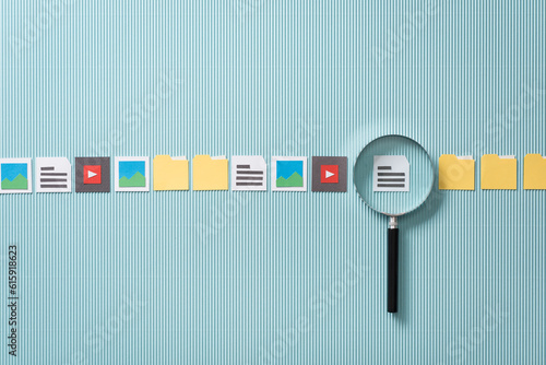 File search, scan and analysis: magnifier zooming in on a file, paper cut icons